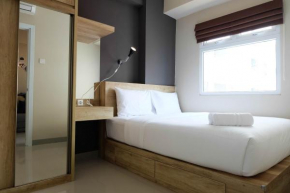 Modern and Bright 2BR Green Pramuka Apartment By Travelio